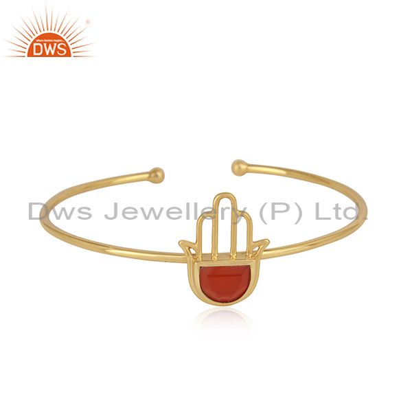Designer hamsa hand cuff in yellow gold on silver with red onyx