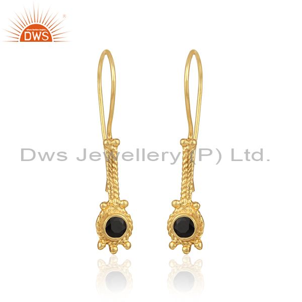 Designer long earring in yellow gold on silver with black onyx
