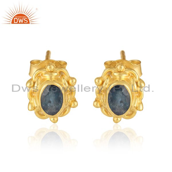 Textured earring in yellow gold over silver with blue sapphire