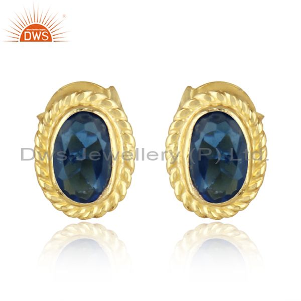Textured silver stud with blue corundum and yellow gold plating