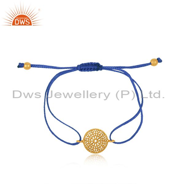 Filigree mandala design gold on silver sky blue cord bracelet
