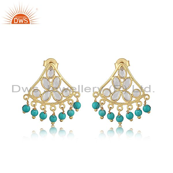 Traditional designer earring in gold on silver with turquoise, cz