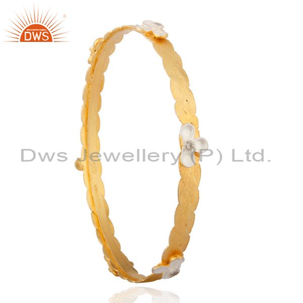 Supplier of Fascinate 18k yellow gold on 925 silver cubic zircon handmade bangle