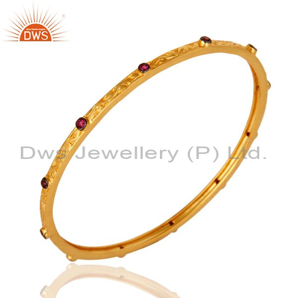 Supplier of Ruby cubic zirconia 22k yellow gold plated brass designer bangle