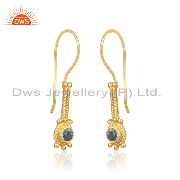 Designer long earring in yellow gold on silver with blue topaz