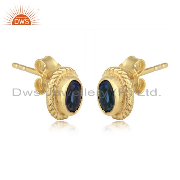 Textured silver stud with blue corundum and yellow gold plating