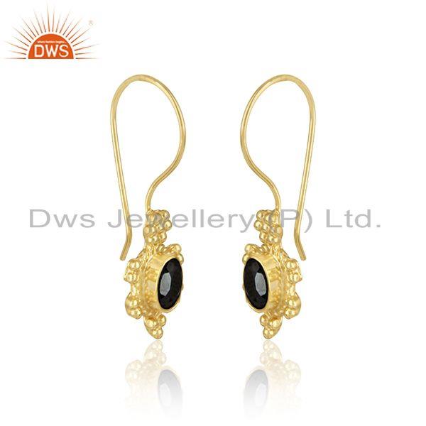 Designer dangle earring in yellow gold on silver with hametite