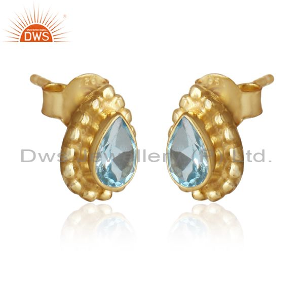 Yellow gold on designer silver blue topaz gemstone stud earrings