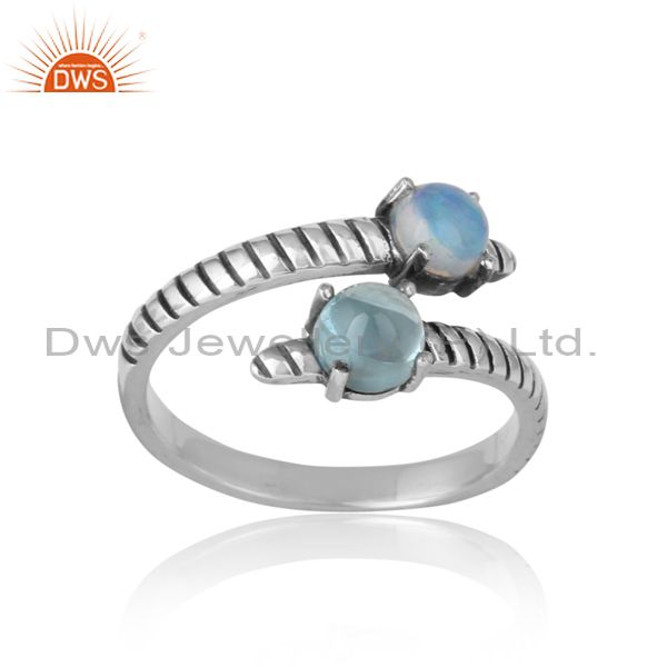 Handmade bypass ring in oxidized silver ethiopian opal blue topaz