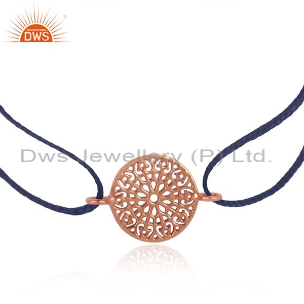 Filigree mandala design rose gold on silver blue cord bracelet