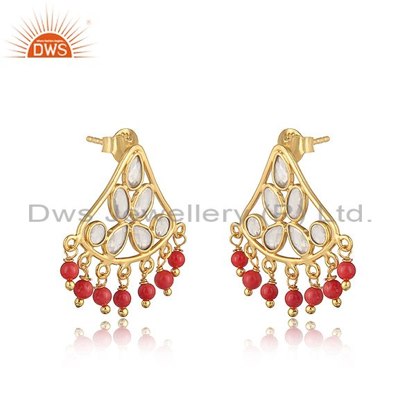 Traditional designer earring in gold on silver with coral and cz