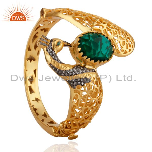 Wholesalers of 18k gold on unique peacock design openable bangle green glass cz