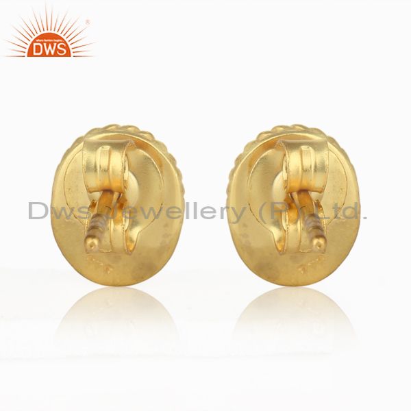 Designer of Textured silver stud with blue corundum and yellow gold plating