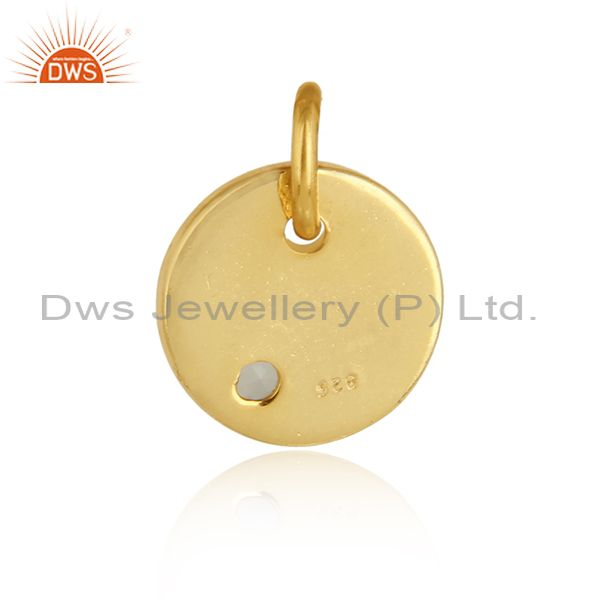 Designer of Dainty charm pendant in yellow gold on silver with aqua chalcedony