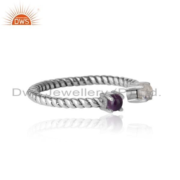 Designer of Twisted ring in oxidized silver rainbow moonstone and amethyst