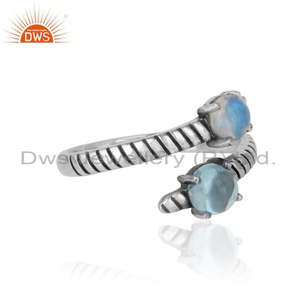 Designer of Handmade bypass ring in oxidized silver ethiopian opal blue topaz