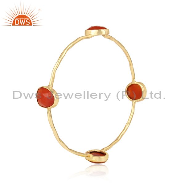 Textured designer gold on fashion bangle with multi red onyx
