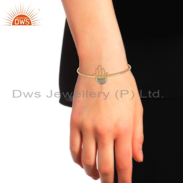 Designer hamsa hand cuff in yellow gold on silver 925 with smoky